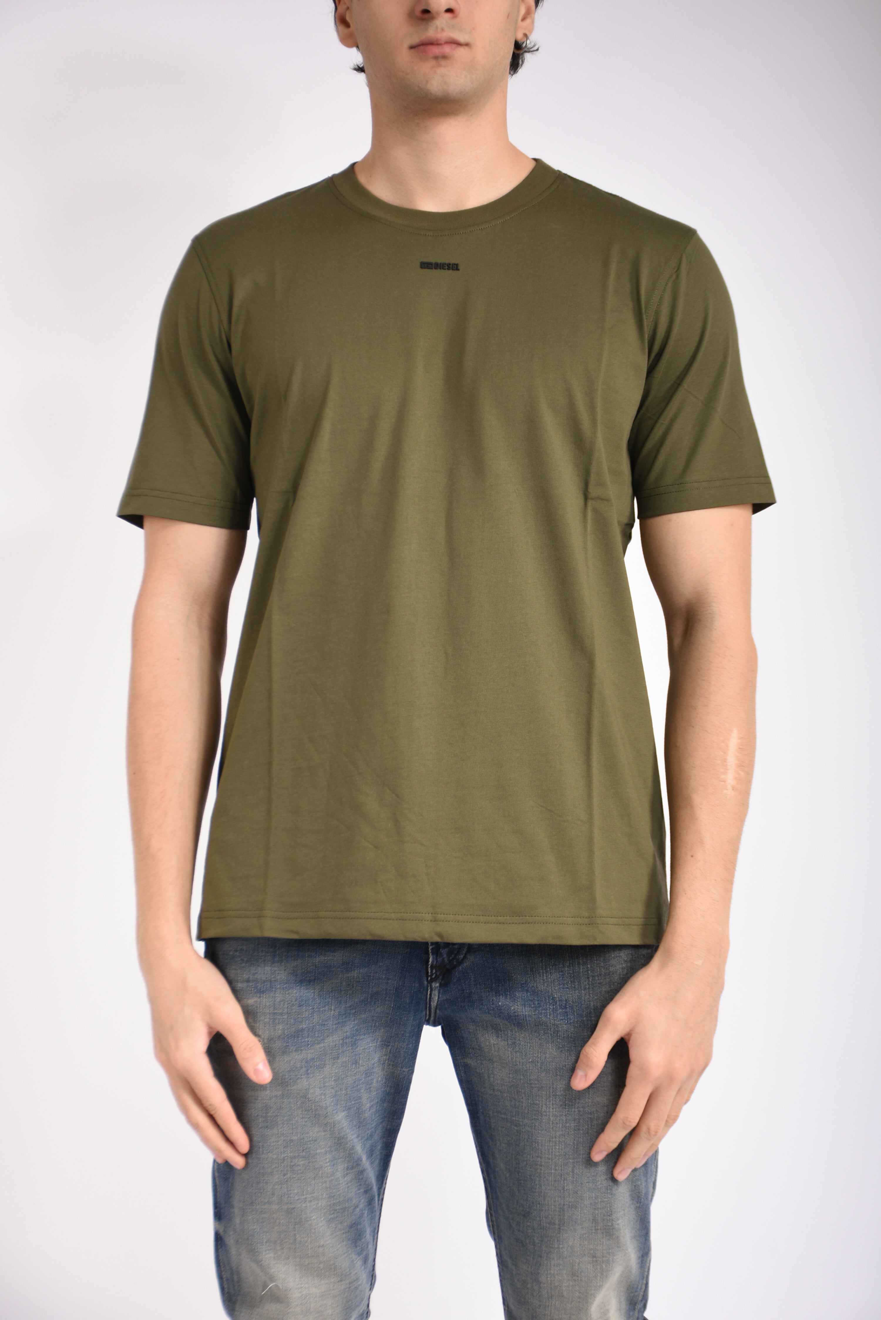 T-shirt con logo micro in metallo