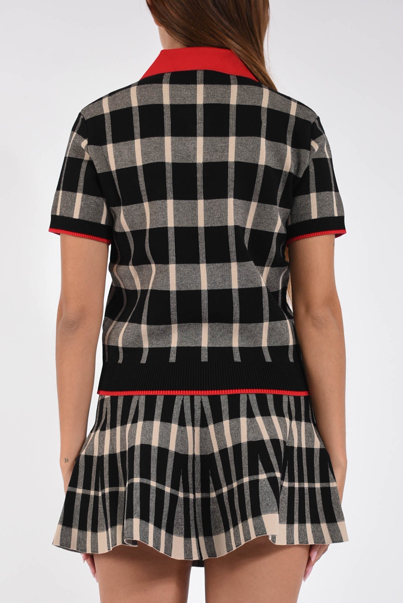 polo in techno piquet con motivo check