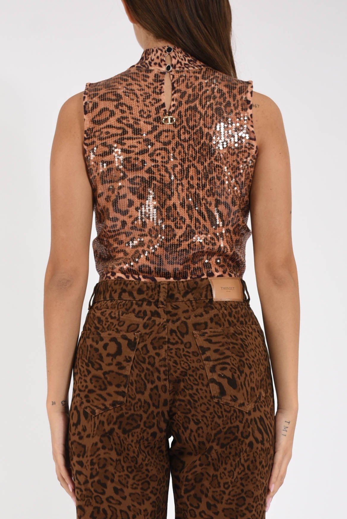 Top in maglia con paillettes