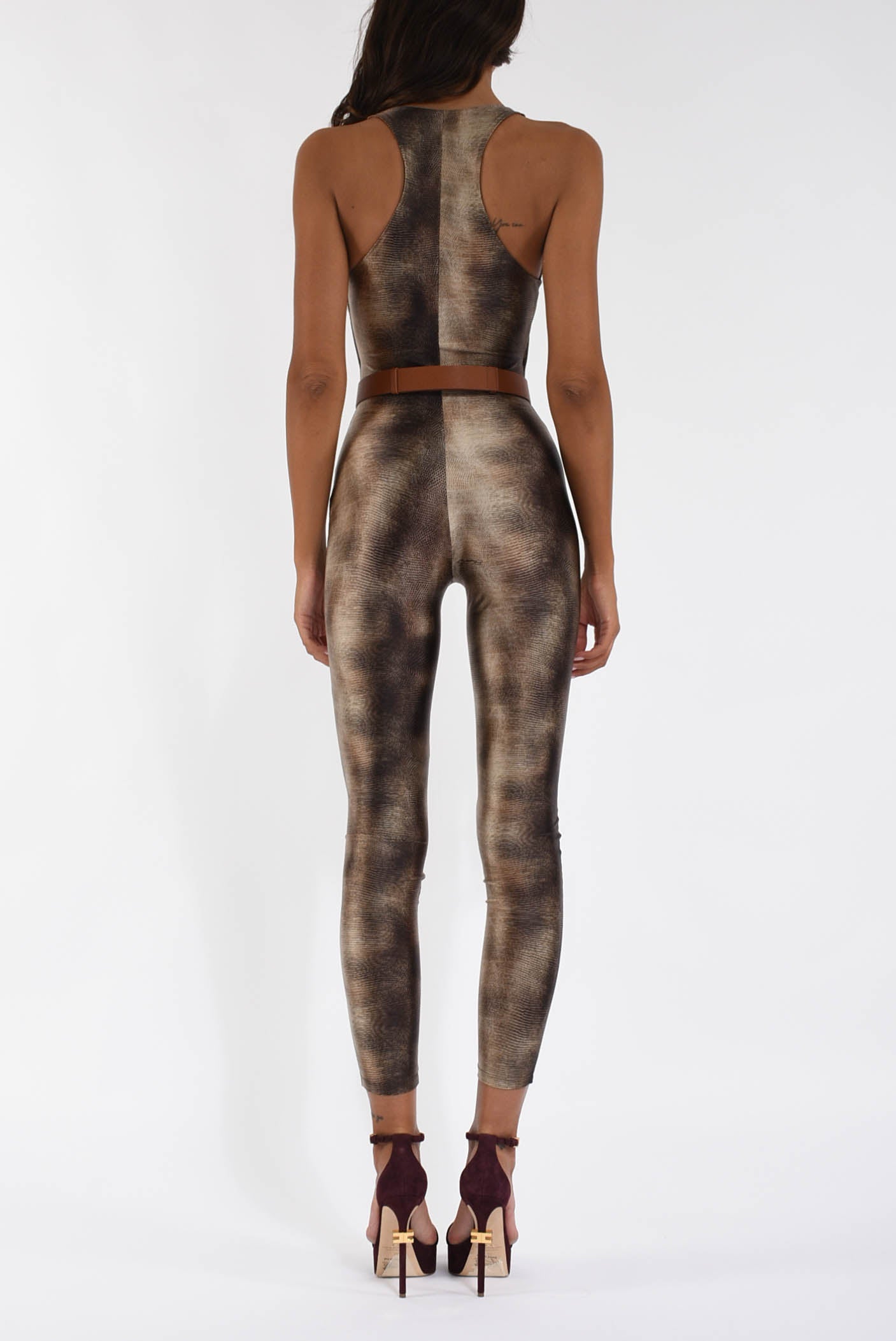 Tuta in lycra con stampa pitone e cintura