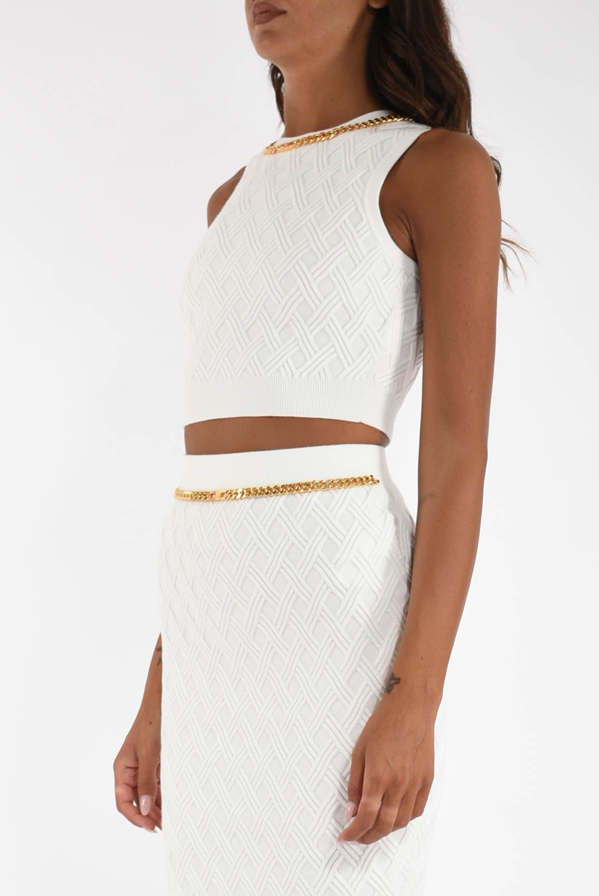 Top in maglia a rombi con dettaglio gioiello