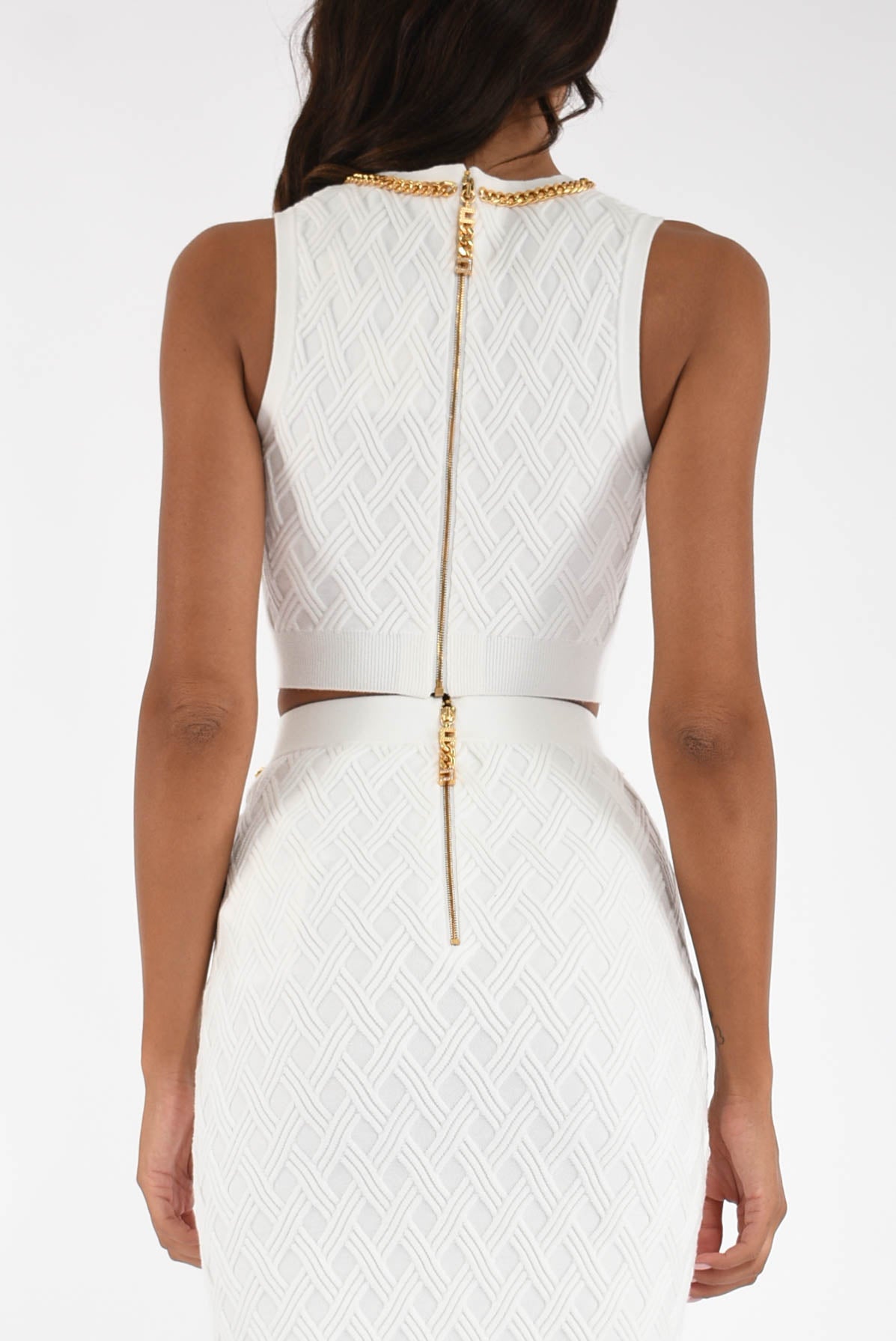 Top in maglia a rombi con dettaglio gioiello