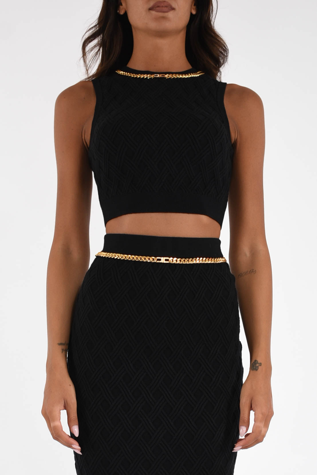 Top in maglia a rombi con dettaglio gioiello