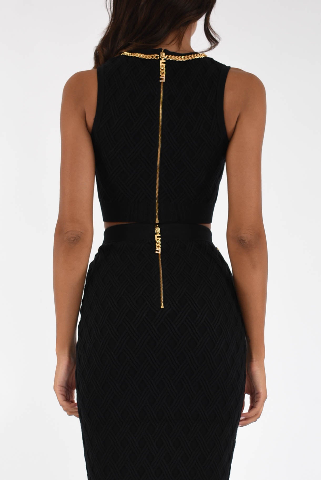 Top in maglia a rombi con dettaglio gioiello