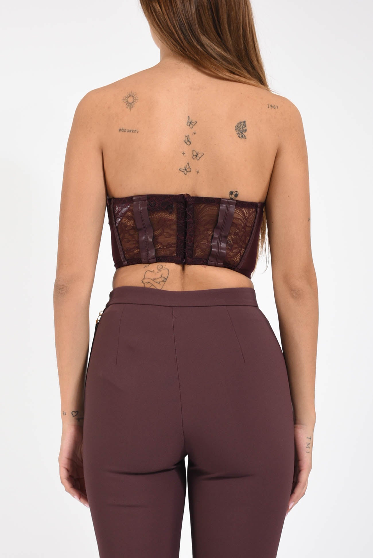 Top bustier in pizzo con logo gioiello