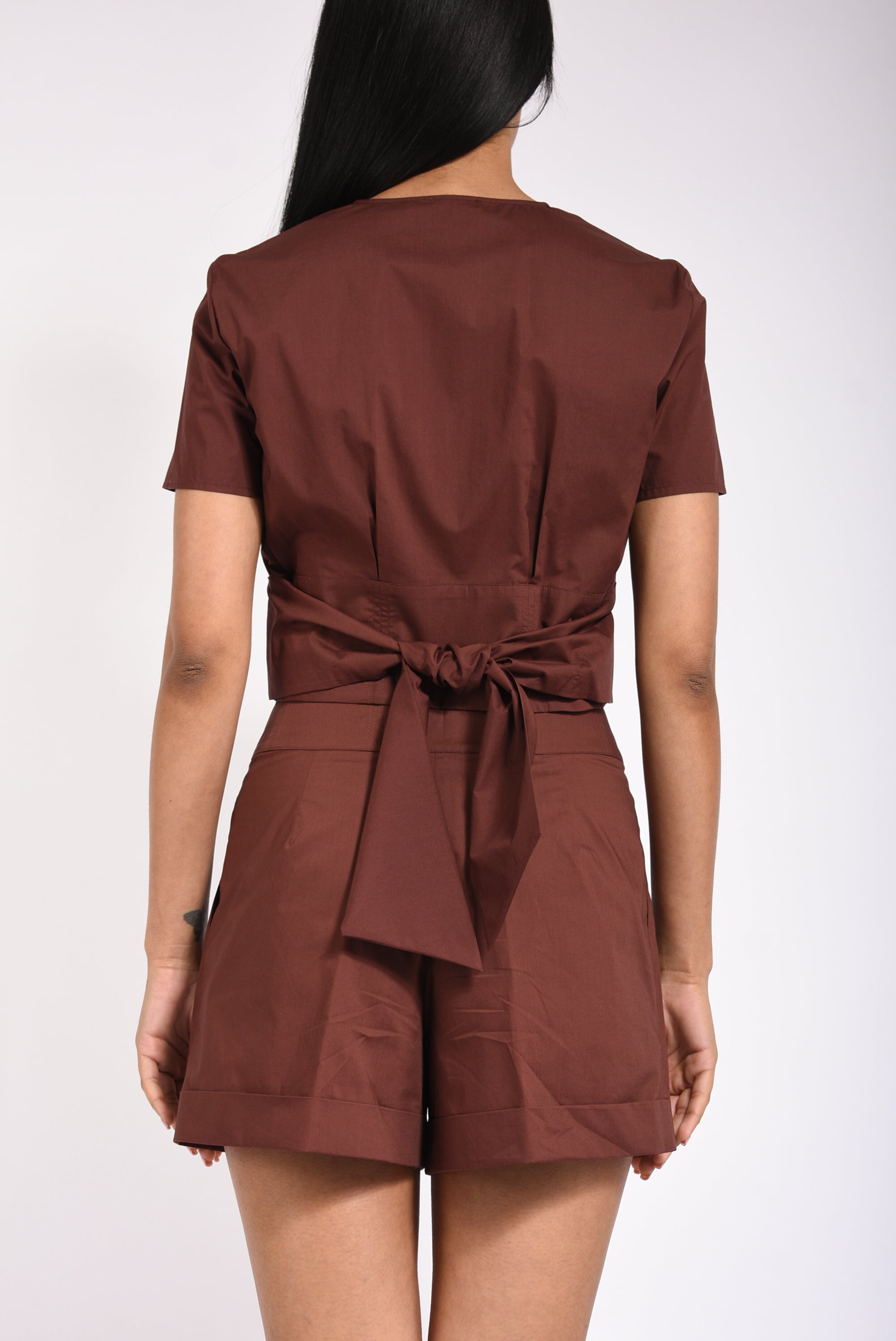 Top cropped con zip