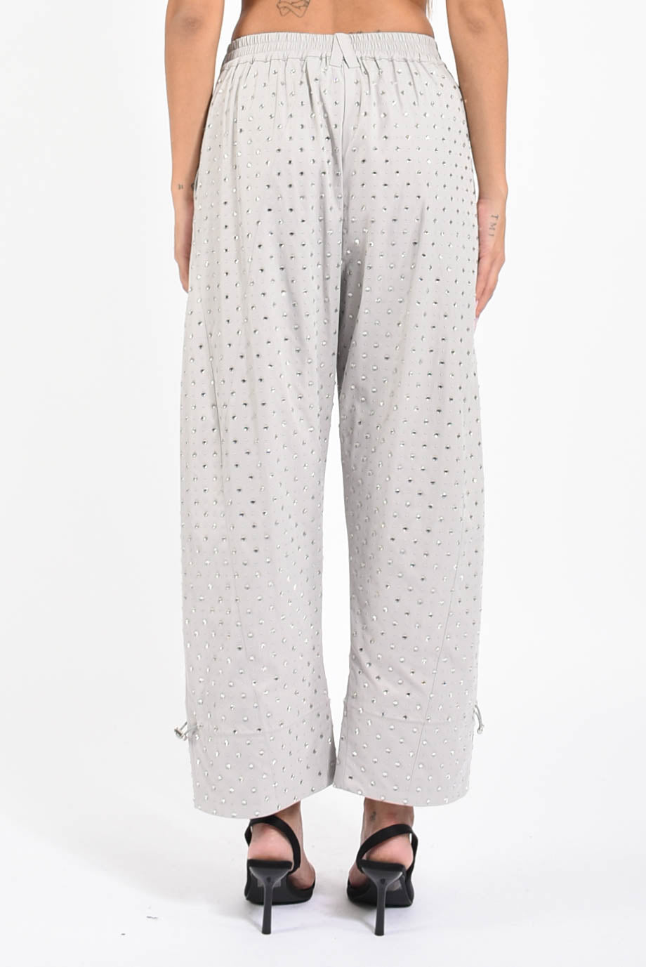 Pantaloni con strass pepita